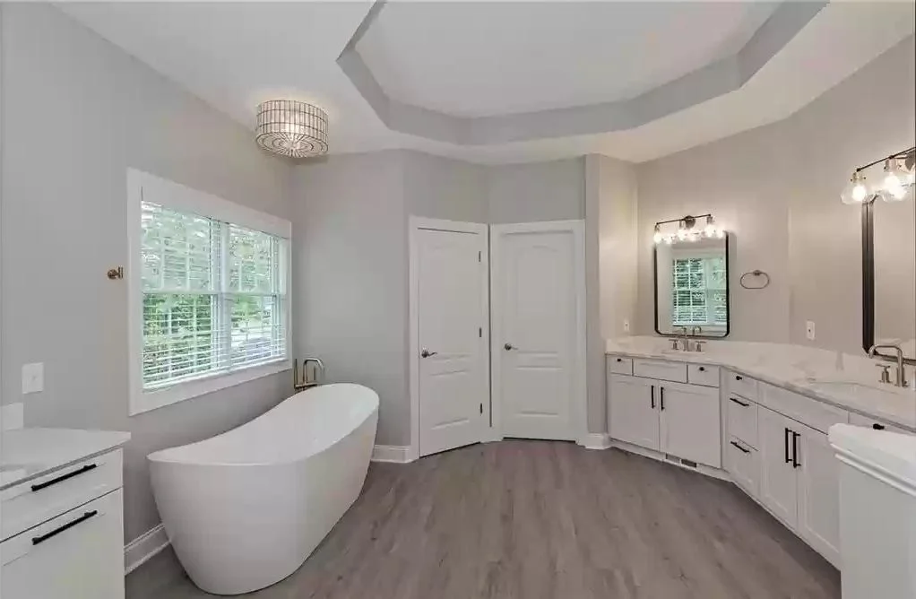 Light and airy bathroom with a freestanding bathtub and double vanity
